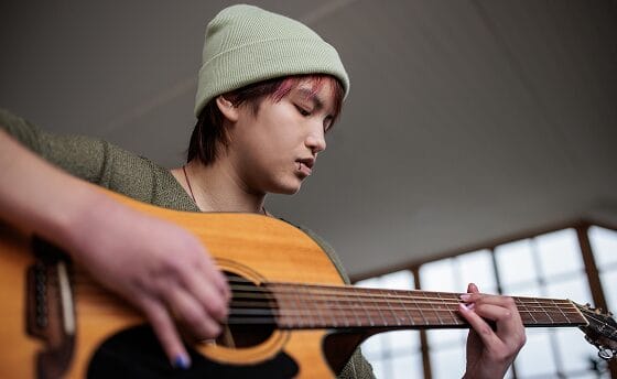 Student playing guitar